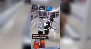 A woman and her first bowling throw