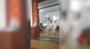 A man trains his "balls of steel" by being hit with a 40 kg log