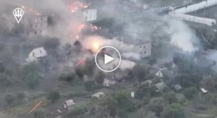 A Ukrainian BMP "Marder" shells a house with Russian soldiers in the village of Malaya Loknya in Kursk regions