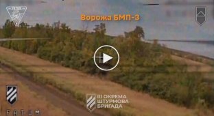 A Russian soldier jumps out of a KamAZ truck on the move to escape a suicide drone attack