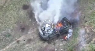 A Russian and his armored personnel carrier are burning out on Ukrainian soil