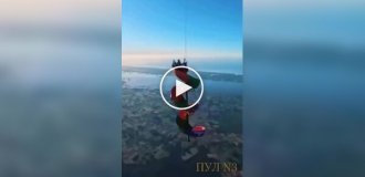 A guy and a girl rolled down a hill at a great height