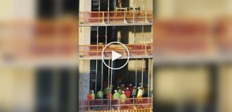 In New York, a crowd of construction workers were spotted warming up before work