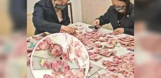 In China, bank employees spent 22 days gluing together banknotes cut up by a depressed woman (2 photos)