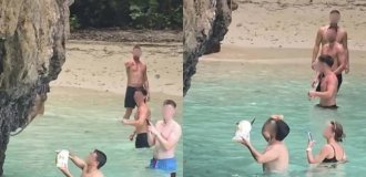 В Таиланде пообещали наказать туристов, которые кормили обезьяну чипсами (2 фото + 1 видео)