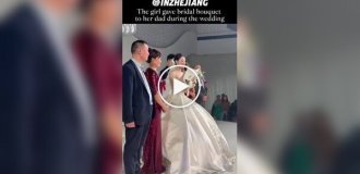 A bride gave her father a wedding bouquet