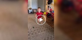 A child's reaction to a gift in honor of his 2nd birthday