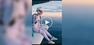 A cute girl jumps with a parachute