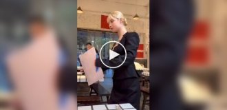 In one of the cafes Waitresses move like robots
