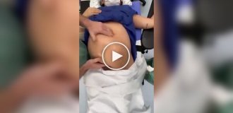 Doctor turns baby over in mother's belly to avoid cesarean section