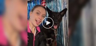 A girl imitates her dog