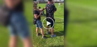 Wife helps her blind husband "see" how their child plays football