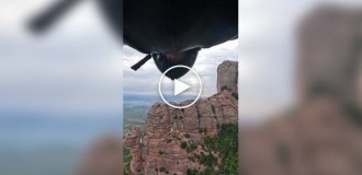 Flying through a small triangular hole in the famous Montserrat mountain in Catalonia