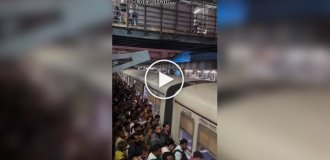 Typical boarding a train in India