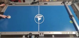 Air hockey-playing robot