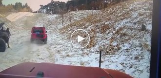An unsuccessful climb: An SUV rolls backwards