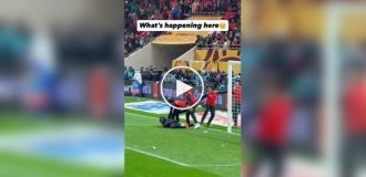 Ballboys attempt to take a towel from the Senegalese goalkeeper