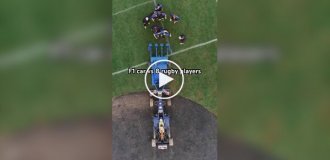 Formula 1 car vs. rugby players