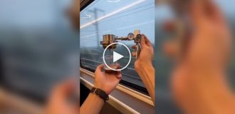 A Chinese man makes coffee on the way to work right on the train