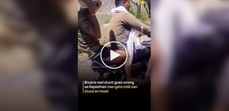 Чудак использовал бидон вместо шлема, но застрял в нем