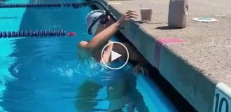 Katie Ledecky balancing a glass of chocolate milk on her head while swimming