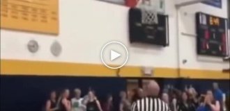 Referee kicks out a ball that got stuck in the ring