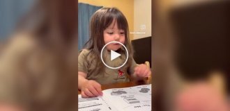 A cute girl is learning English