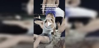 A man accidentally sat on a girl's face on the beach