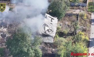 Fighters of the 28th Separate Motorized Brigade attack a building where occupiers are hiding with a kamikaze drone