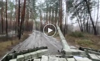 A Ukrainian tank shoots at Russian positions in the Kremensky forest from close range