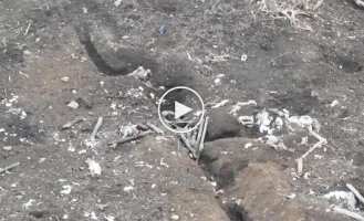 An occupier flies over a trench after a Ukrainian drone strike