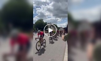 Woman on scooter causes crash at German bike race