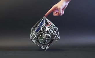 A Cube That Can Jump, Walk, and Stand on a Corner