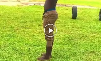 Cool acrobat shows off his skills in the backyard