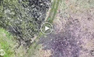 A Russian invader swings across a field with a severed leg