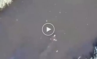 Russian floating in river turns into bloody stain on water after being hit by Ukrainian ammunition