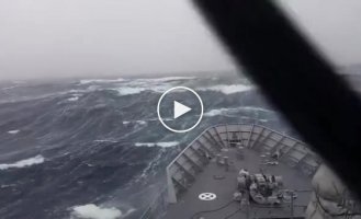 Beautiful shots. Ship passing through huge waves in a storm