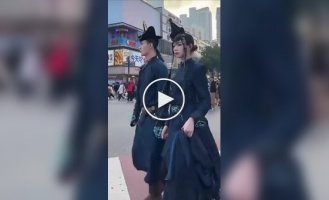 A couple from China walked around the city in traditional clothes