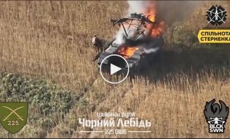 A Russian crawls on all fours from his burning armored vehicle and dies in a field