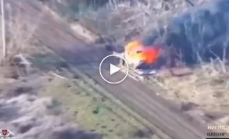 An enemy car is on fire after an attack by the Wild Hornets drone