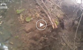 A Ukrainian soldier shoots two invaders point-blank during a trench battle in the Luhansk region