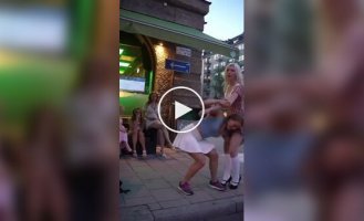 Easy and with a smile: a girl uses her friend as a squat bar