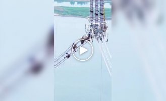 The Challenging Work of High-Voltage Line Installers in China
