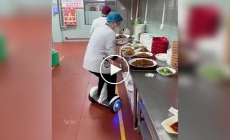 In a Chinese restaurant, waiters move between tables not on foot, but on gyro scooters