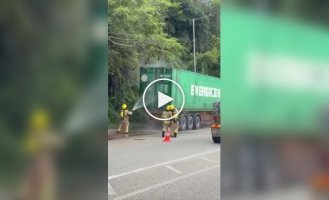 A truck carrying batteries caught fire in Hong Kong and exploded