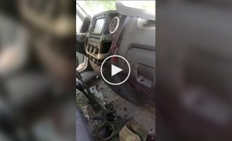 The interior of a car of Russian occupiers after an attack by a Ukrainian FPV drone somewhere at the front