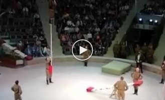 A very dangerous trick performed by an acrobat