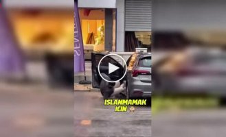 A man tried to jump into a car during a downpour in Turkey