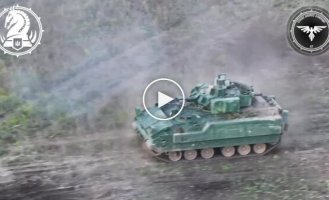 Ukrainian M2A2 "Bradley" ODS-SA infantry fighting vehicle fires at Russian positions in the Avdeevsky direction