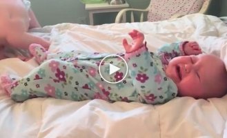 This toddler knows how to calm his little sister down when she starts crying.